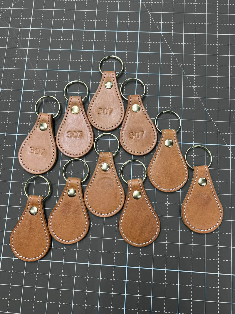 Leather key fobs stamped 307, the Wyoming area code.